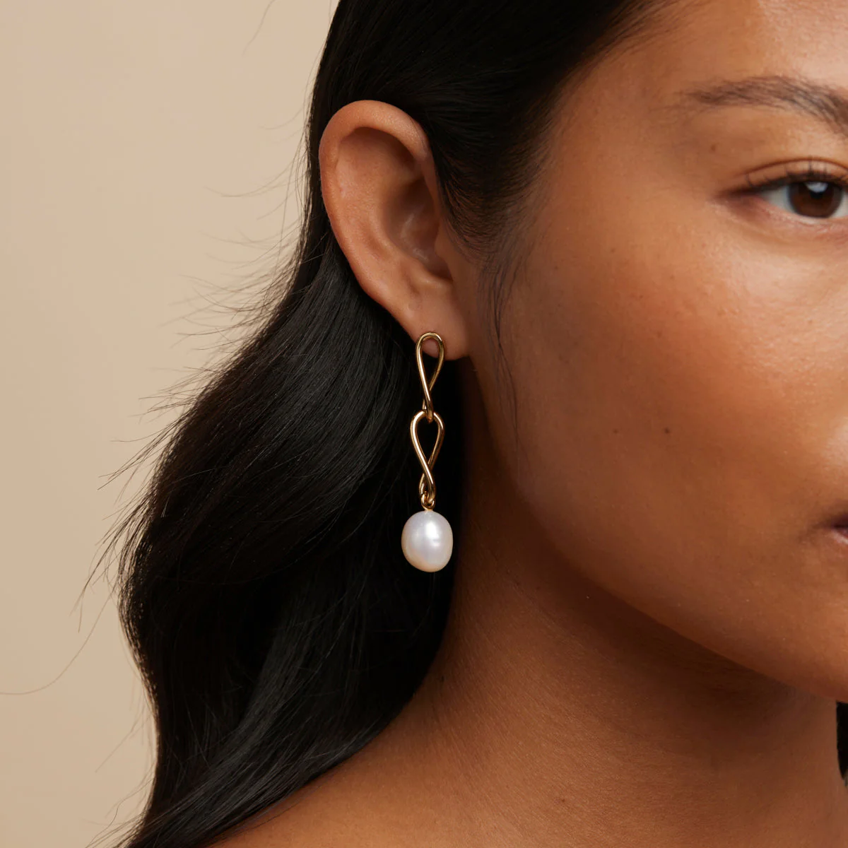 Infinite Pearl Drop Studs in Gold - Image 2