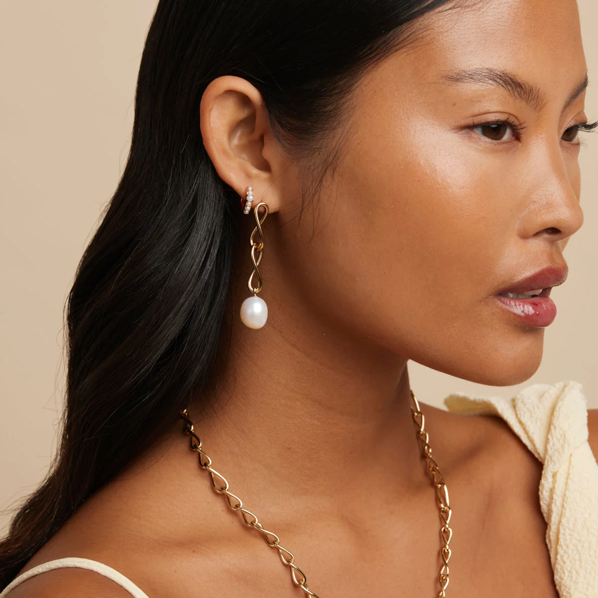 Infinite Pearl Drop Studs in Gold - Image 3
