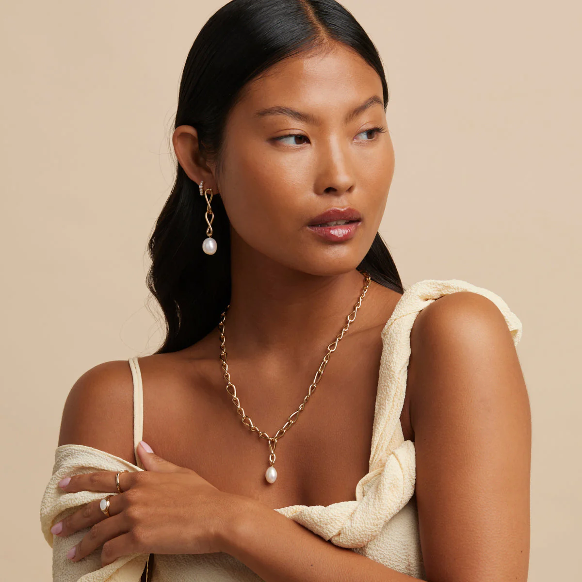 Infinite Pearl Drop Studs in Gold - Image 4