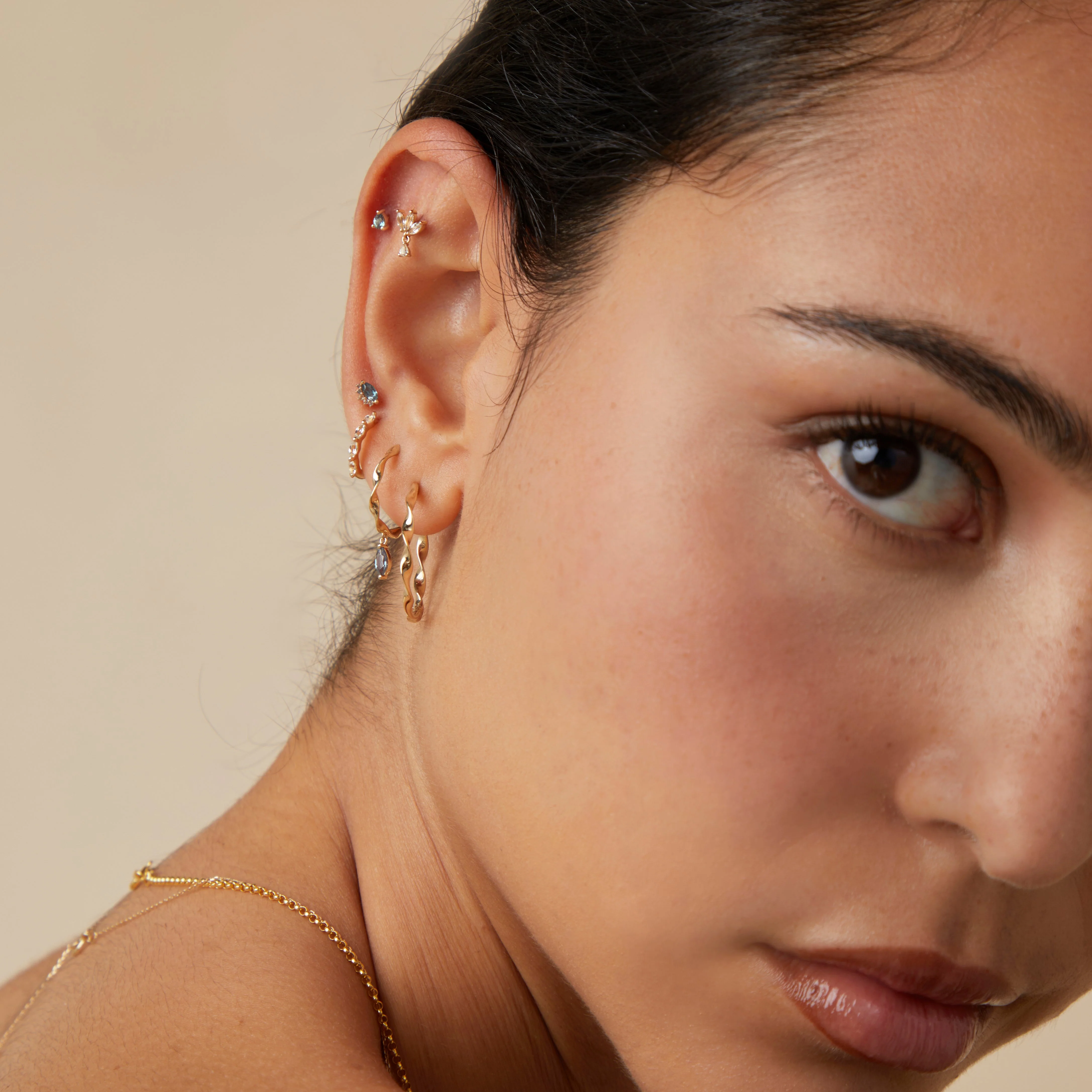 White Topaz Marquise Huggies in Solid Gold - Image 4